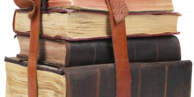 PhotoObjects.net/PhotoObjects.net/Getty Images Recycle old books into whimsical, vintage wallpaper.