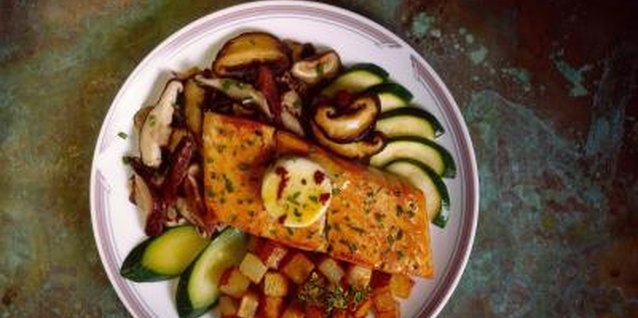Jupiterimages/Comstock/Getty Images Grilled salmon adds a smoky flavor to dinnertime.