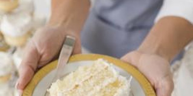 Dynamic Graphics/Creatas/Getty Images Adding color makes a layered cake more festive.