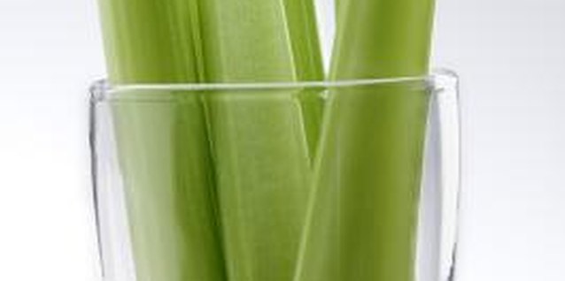 Jupiterimages/liquidlibrary/Getty Images Dark green varieties of celery tend to have a stronger flavor than lighter varieties.