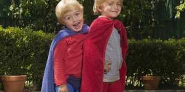Jupiterimages/BananaStock/Getty Images Help little ones imagine superhero greatness with a homemade cape.