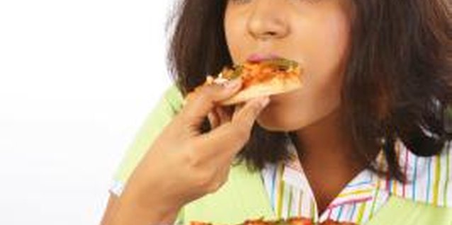 Visage/Stockbyte/Getty Images Parents can influence a teen's dietary choices.