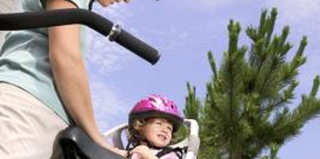 Thinkstock Images/Comstock/Getty Images Toddlers should be secured in their bicycle seats.