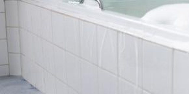 Jupiterimages/Pixland/Getty Images Supplementing your garden with bathwater helps save cash.
