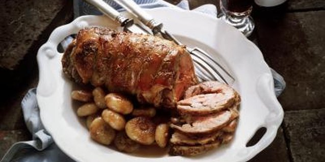 Eising/Photodisc/Getty Images Microwaved lamb looks just like oven-roasted lamb when cooked properly.