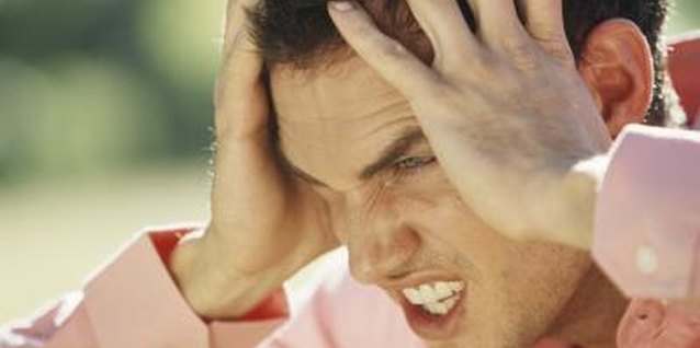 Stockbyte/Stockbyte/Getty Images Don't let a moody guy's bad mood become your bad mood.