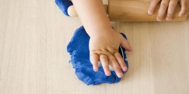 Jupiterimages/Polka Dot/Getty Images Kids this age just love to mold, squeeze and squish play dough.