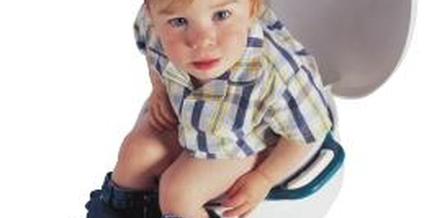 Comstock/Comstock/Getty Images Parents and teachers need to discuss potty training tips for toddlers.
