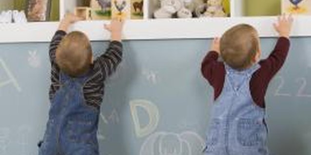 Comstock Images/Comstock/Getty Images Healthy twins likely reach milestones on track.