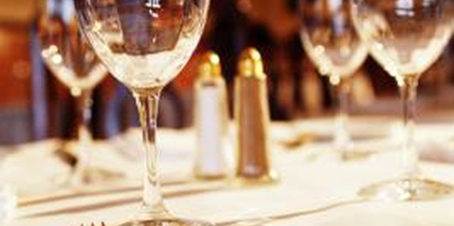 Thinkstock Images/Comstock/Getty Images Teach proper dining etiquette to your teenager.