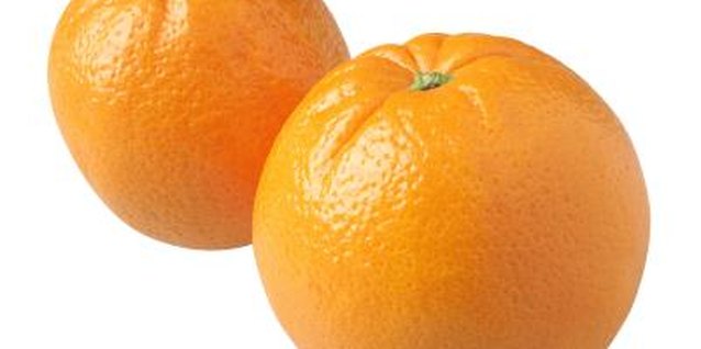 Stockbyte/Stockbyte/Getty Images Ignore color when identifying ripe oranges. Homegrown fruit is usually paler than color-injected commercial fruit, but this will not affect its flavor.