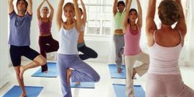 Creatas/Creatas/Getty Images Sun Salutations serve as a warm-up for your workout.