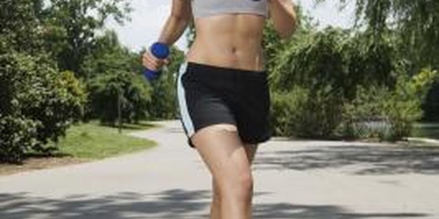 Jupiterimages/Brand X Pictures/Getty Images Walking is an excellent way for beginners to tone their legs.