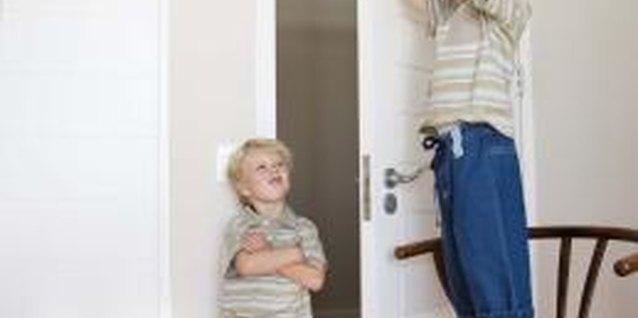 Jupiterimages/Goodshoot/Getty Images Setting rules helps children understand what is not acceptable when home alone.