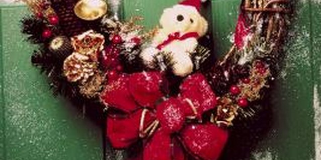 NA/AbleStock.com/Getty Images A homemade vintage wreath personalizes a front door.
