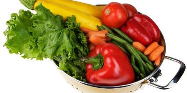 Photos.com/PhotoObjects.net/Getty Images Vegetables are high in water and fiber, both of which help you to feel full.