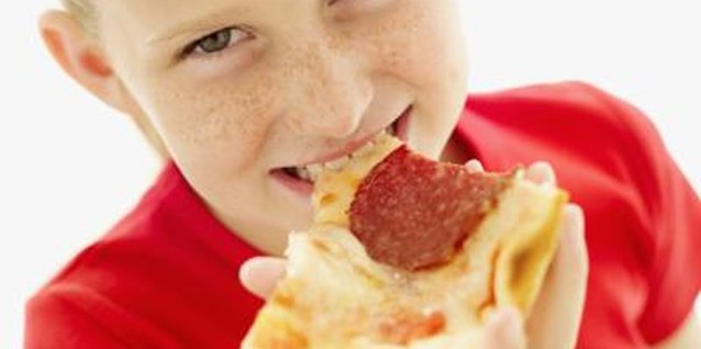 Stockbyte/Stockbyte/Getty Images Kids ages 3 to 11 prefer pizza for lunch and dinner, according to Pizza.com.