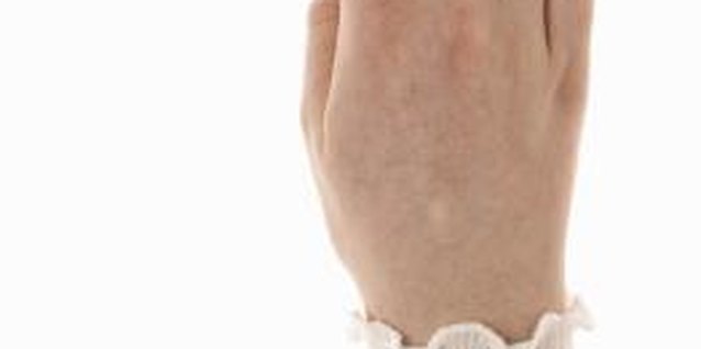 Thomas Northcut/Photodisc/Getty Images Cutting off a tight ring is a last resort.
