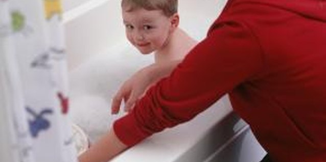 Ryan McVay/Photodisc/Getty Images Keeping a toddler's arm dry during a bath can be difficult.
