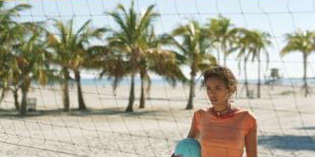 Digital Vision/Digital Vision/Getty Images Proper warm-ups can help avoid arm pain in volleyball.