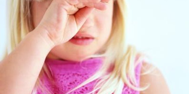 George Doyle/Stockbyte/Getty Images Bullying can result in symptoms like crying and stomachache.