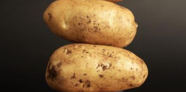 Ciaran Griffin/Stockbyte/Getty Images Potato (Solanum tuberosum) cloning has been around for generations.