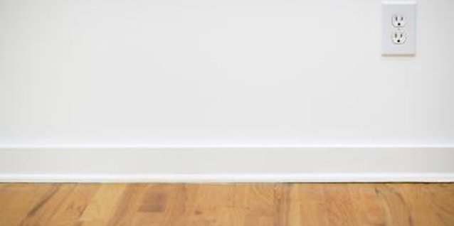 Jupiterimages/Brand X Pictures/Getty Images Match your outlet covers with the existing wall color to mask them.