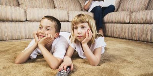 Jupiterimages/Brand X Pictures/Getty Images Your kids may choose TV over you.