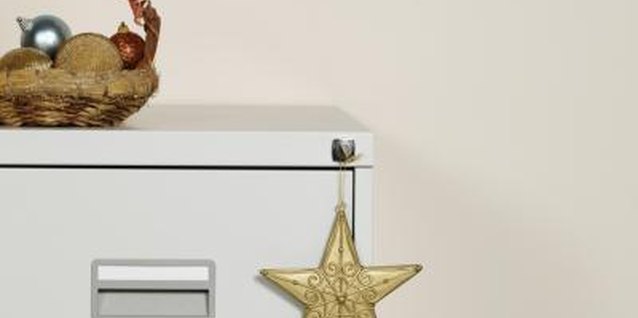 Stockbyte/Stockbyte/Getty Images Spice up your desk with easy decorations made of office supplies.