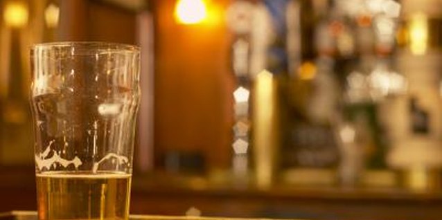 Hemera Technologies/AbleStock.com/Getty Images The natural sugars in beer make it a good food for plants.