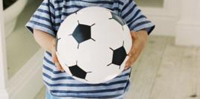 BananaStock/BananaStock/Getty Images Running, hopping, throwing and catching are some of the many skills your child will develop during her toddler years.