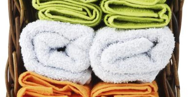 Photos.com/PhotoObjects.net/Getty Images Check the label of a towel and verify that it is 100 percent cotton before making your purchase.