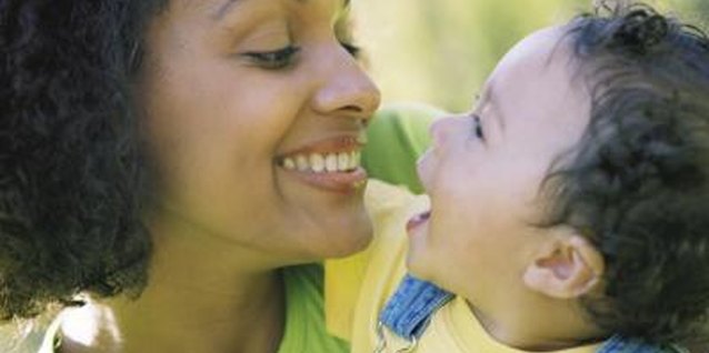 BananaStock/BananaStock/Getty Images Talking with babies can encourage early talking and learning.