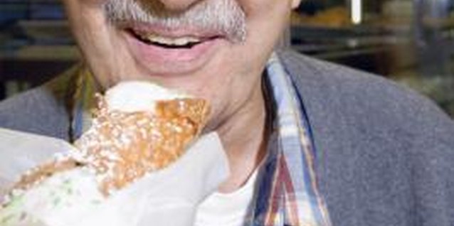 Jupiterimages/Comstock/Getty Images Baking cannoli shells can be lower in cholesterol than fried ones.