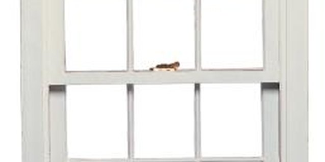 Comstock/Comstock/Getty Images Stop window drafts inexpensively, using plastic sheeting.
