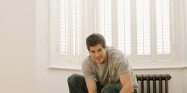 Jupiterimages/Pixland/Getty Images Install carpet on even flooring.