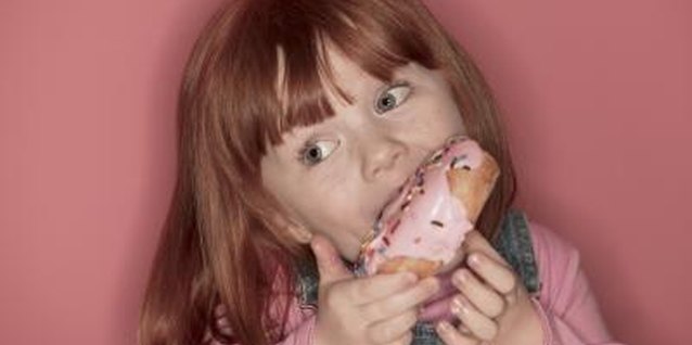 Comstock/Comstock/Getty Images Your little one will enjoy the tradition of consuming soul cakes on All Saints' Day.