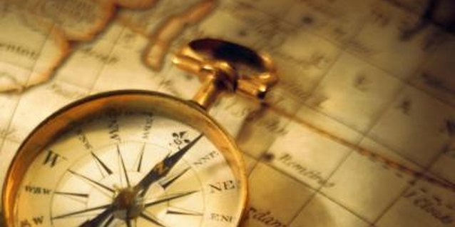 Comstock/Comstock/Getty Images Nautical antiques like sea charts and navigation equipment make ideal decorations for a fireplace mantel.