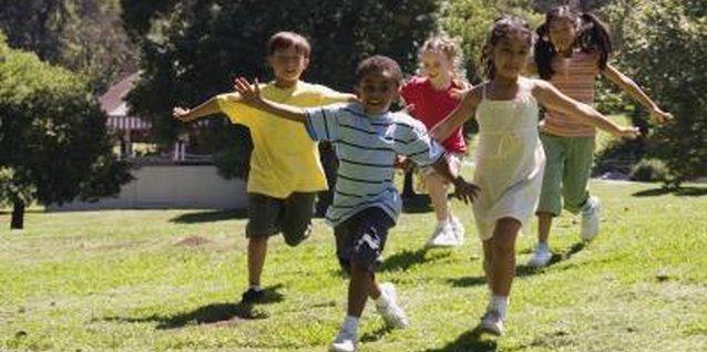 Jupiterimages/Brand X Pictures/Getty Images Challenge your child to a physically or mentally demanding game.
