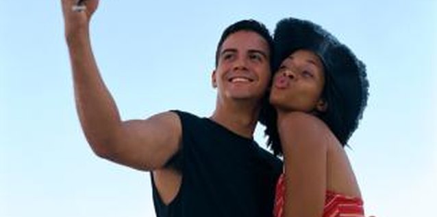 Creatas/Creatas/Getty Images Get close to your male friend to ignite chemistry between you.