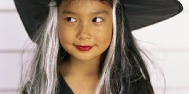 Stockbyte/Stockbyte/Getty Images Heat damages your child's synthetic play wig.