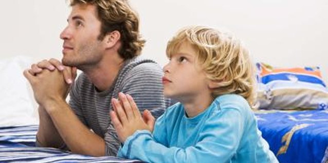 Jupiterimages/Polka Dot/Getty Images Show your toddler how to pray and let him hear your prayers.