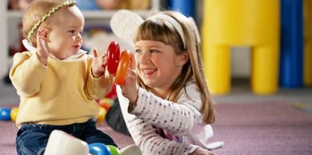 Brand X Pictures/Brand X Pictures/Getty Images Encourage healthy play between siblings.