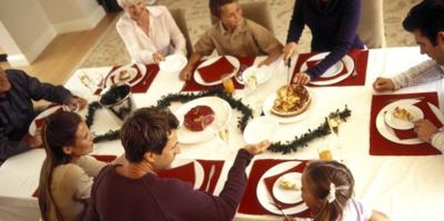 Pixland/Pixland/Getty Images Teach your child how to help serve dinner from an early age.