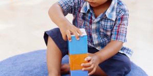 Stockbyte/Stockbyte/Getty Images Toys help toddlers experiment and explore basic thinking strategies.