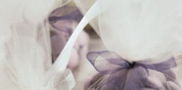 Comstock/Comstock/Getty Images Brides often wrap birdseed or wedding favors in tulle.