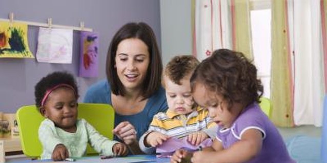 Jupiterimages/Comstock/Getty Images Toddlers mimic attitudes and actions of other toddlers.
