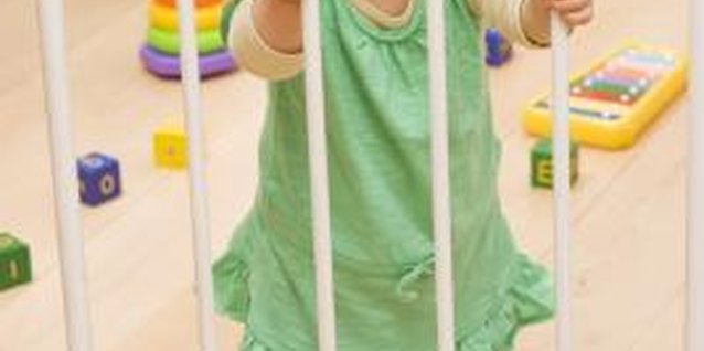 BananaStock/BananaStock/Getty Images Safety gates are an easy way to contain toddlers.