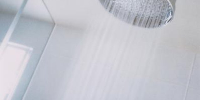 Ryan McVay/Photodisc/Getty Images A shower pan leak needs immediate attention to prevent costly repairs.