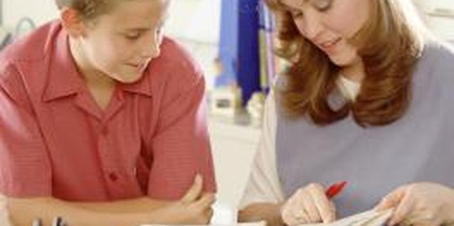 Brand X Pictures/Brand X Pictures/Getty Images A paraprofessional can help students.